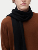 Unisex Cashmere Jersey Knit Scarf Black worn by model, detail view on white background