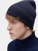 Unisex Cashmere Rib Knit Beanie Navy Blazer worn by model, detail view on white background
