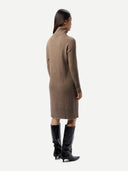 Women's  Seamless Turtleneck Cashmere Dress Taupe worn by model back view on white background