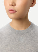 Women's Short-Sleeve Cashmere Sweater Grey worn by model, detail view on white background