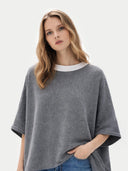 Women's Boat-Neck Cashmere Poncho Grey worn by model, detail view on white background

