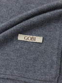 Unisex Cashmere Jersey Knit Scarf Dim Gray worn by model, detail view on white background