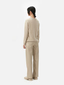 Women's Warm Grey Cashmere V-neck Button Cardigan worn by model, back view on white background