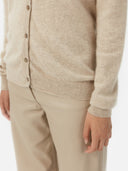 Women's Warm Grey Cashmere V-neck Button Cardigan worn by model, detail view on white background