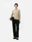 Women's Warm Grey Cashmere Crew Neck Sweater worn by model, front view on white background