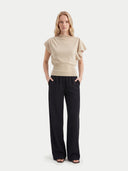 Women's Beige Cashmere Asymmetrical Top worn by model, front view on white background