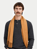 Cashmere Fringed Scarf Almond worn by model, detail view on white background