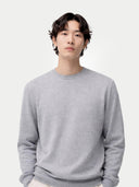 Men's high rise Cashmere Crewneck Sweater worn by model, detail view on white background 
