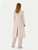 Women's  Double-Breasted Long Coat Beige worn by model back view on white background