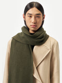 Unisex Cashmere Fisherman Knit Scarf Capulet Olive worn by model, detail view on white background
