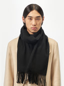 Cashmere Fringed Scarf Black worn by model, detail view on white background
