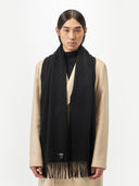 Cashmere Fringed Scarf Black worn by model, detail view on white background