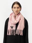 Unisex Cashmere Fringed Scarf Almond Blossom worn by model, detail view on white background
