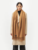 Unisex Cashmere Oversized Woven Scarf Almond worn by model, detail view on white background