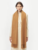 Unisex Cashmere Oversized Woven Scarf Almond worn by model, detail view on white background
