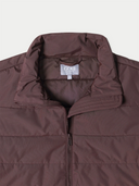 Brown puffer jacket with a visible brand label on a white background