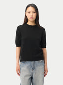 Women's Cashmere Elbow-Length Sleeve Cashmere Sweater Black worn by model, detail view on white background