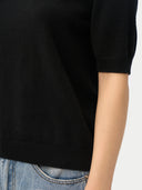 Women's Cashmere Elbow-Length Sleeve Cashmere Sweater Black worn by model, detail view on white background
