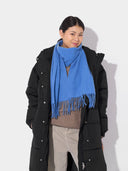 Cashmere Fringed Scarf Blue Cashme worn by model, detail view on white background