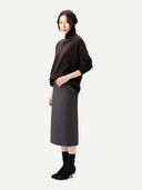 Unisex High-Neck Cashmere Sweater Mole worn by model, side view, on white background