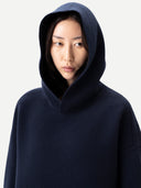 Unisex Inida Ink Cashmere Sweatshirt worn by model, detail view on white background