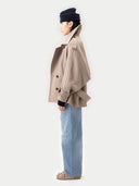 Women's Taupe Trench-Style Cashmere Peacoat  worn by model, side view on white background
