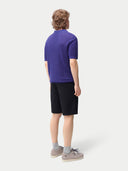 Men's Cashmere Silk Polo Skipper Blue worn by model, back view on white background
