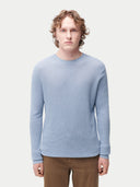 Men's Cashmere Silk Lightweight Sweater Celestial Blue worn by model, detail view on white background