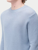 Men's Cashmere Silk Lightweight Sweater Celestial Blue worn by model, detail view on white background