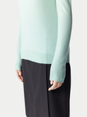 Women's Seledan Cashmere Crew Neck Sweater worn by model, detail view on white background.