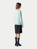 Women's Seledan Cashmere Crew Neck Sweater worn by model, back view on white background.