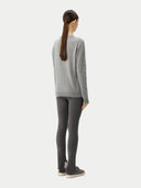 Women's Grey Cashmere Essential Crew Neck Sweater worn by model, back view on white background