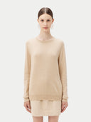 Women's Beige Cashmere Basic Crew Neck Sweater worn by model, detail view on white background
