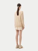 Women's Beige Cashmere Basic Crew Neck Sweater worn by model, back view on white background
