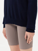 Women's Navy Cashmere Crewneck Sweater worn by model, detail view on white background