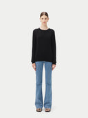 Women's Black Cashmere Crewneck Sweater worn by model, front view on white background