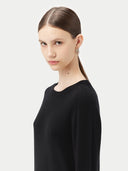 Women's Black Cashmere Crewneck Sweater worn by model, detail view on white background