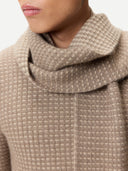 Waffle Knit Cashmere Scarf Taupe worn by model, detail view on white background