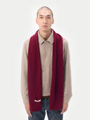 Unisex Cashmere Jersey Knit Scarf Bordeaux worn by model, detail view on white background