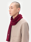 Unisex Cashmere Jersey Knit Scarf Bordeaux worn by model, detail view on white background