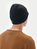 Unisex Black Cashmere Rib Knit Beanie worn by model, back view on white background