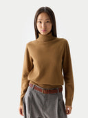 Women's Classic Cashmere Turtleneck Sweater Almond worn by model, detail view, on white background