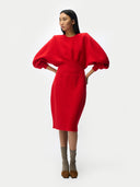 Person wearing a Cashmere Sculptural Dress Fiery Red on a white background