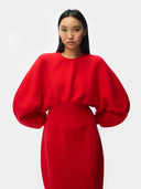 Person wearing a Cashmere Sculptural Dress Fiery Red on a white background