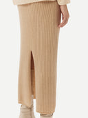 Women's Beige  Cashmere Midi Skirt worn by model, back view on white background