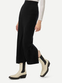 Women's Cashmere Midi Skirt Black worn by model, detail view on white background
