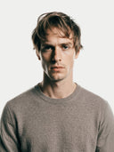 Men's Taupe Crewneck Cashmere Sweater worn by model, detail view on white background