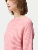 Women's Short Dolman Sleeve Cashmere Sweater Pink Icing  worn by model, detail view on white background