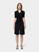 Cashmere Silk Women's Polo Shirt Black   worn by model, front view on white background