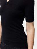 Cashmere Silk Women's Polo Shirt Black   worn by model, detail view on white background